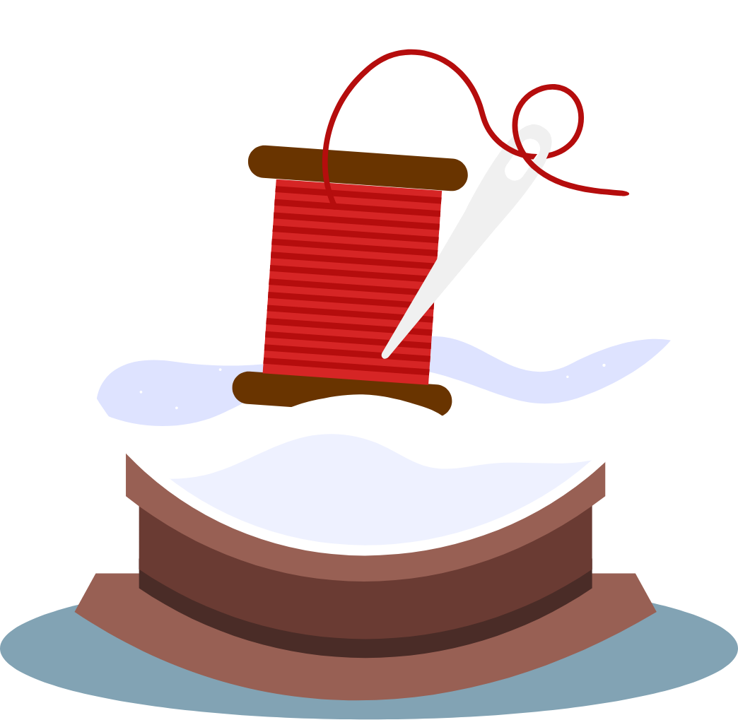 A spool of thread and needle in a snowglobe